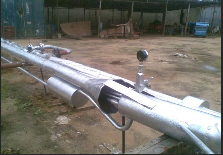 A large metal pipe with pipes
                        
                        Description automatically generated with medium confidence