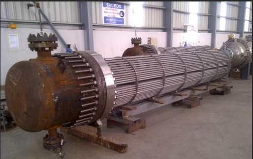 Several large metal tanks with large round cylinders

Description automatically generated with medium confidence