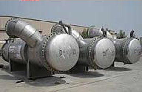 A large metal tube in a factory

Description automatically generated