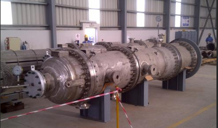 Large metal cylinder in a factory

Description automatically generated