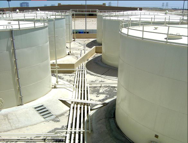 Several white tanks in a factory

Description automatically generated